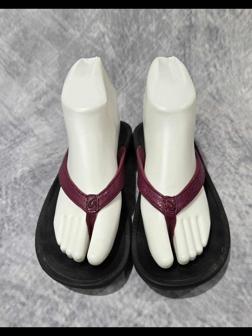 OluKai Women's Kulapa Kai sandals in a bright pink color with a textured strap
